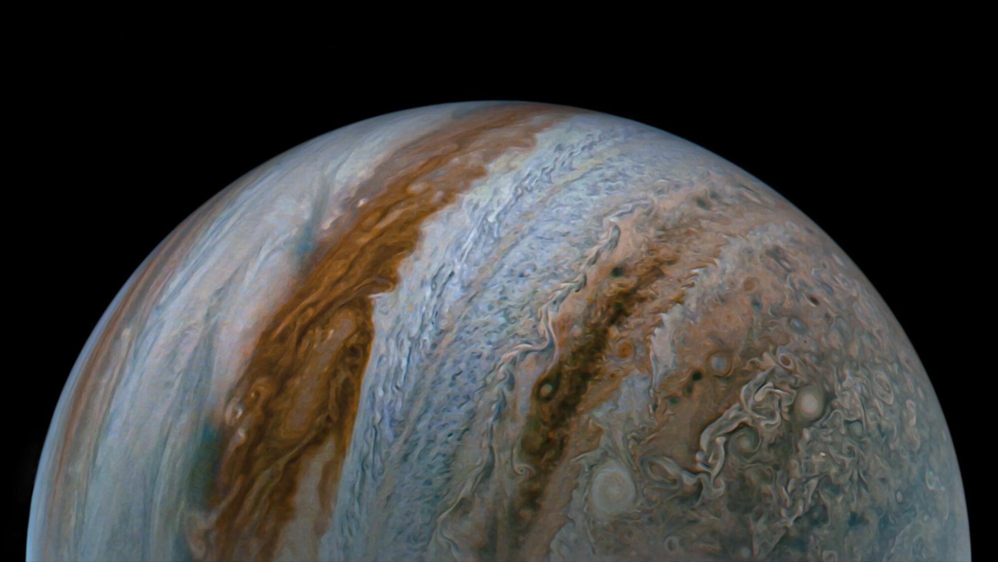Swirling cloud bands on Jupiter — the kind of view a small telescope reveals from a dark site.